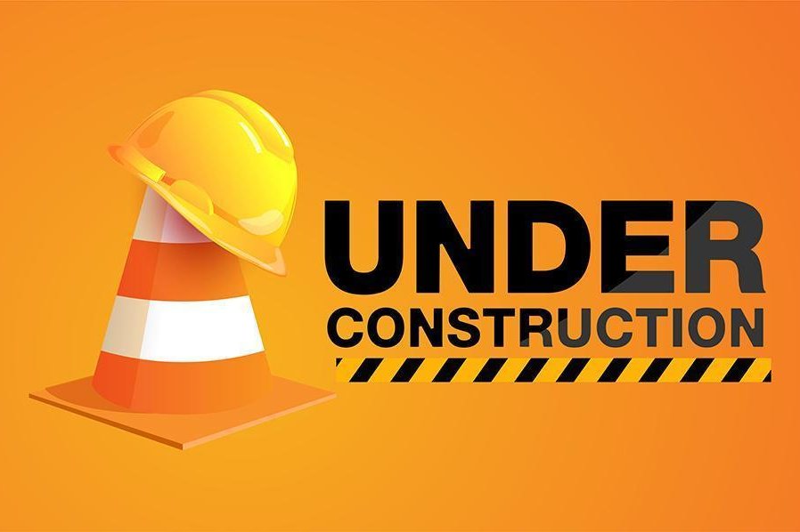 under-construction-sign-with-hat-on-traffic-cone-vector